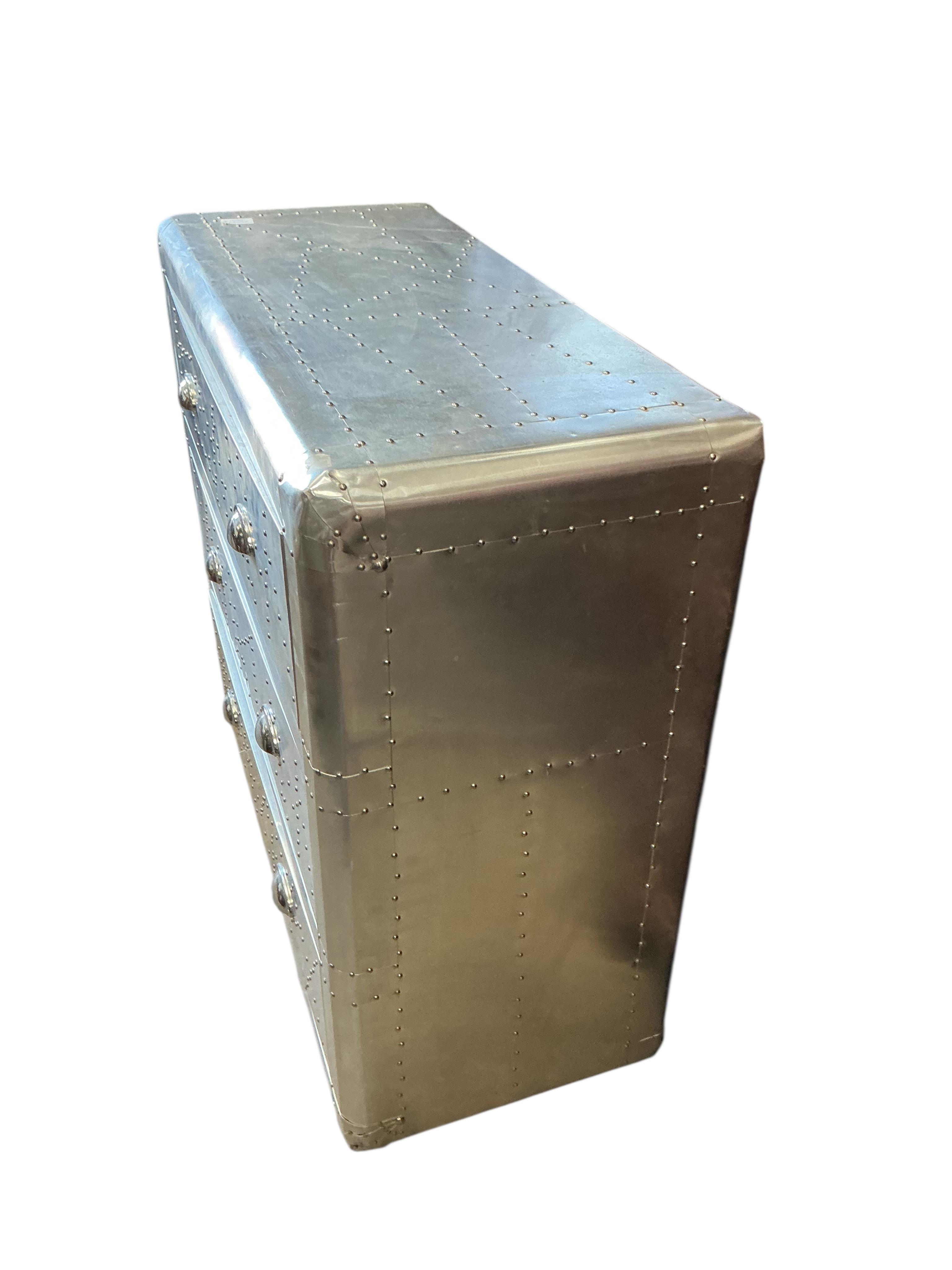 A pair of Contemporary aeronautical style aluminium mounted chest of three drawers, width 90cm, depth 38cm, height 79cm